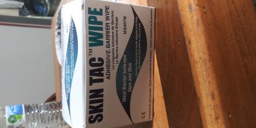 Skin tac wipe